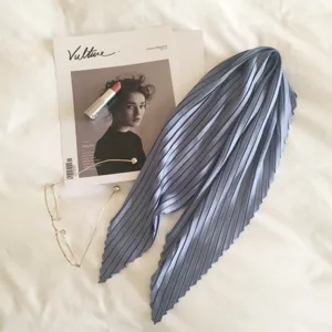 Blue pleated silk-feel neck scarf detail, elegant solid color design for stylish daily wear.