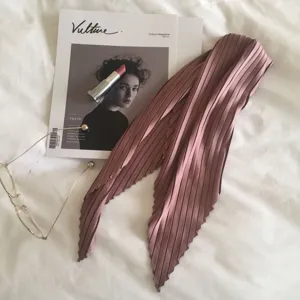 Elegant pleated pink silk-feel scarf, perfect for spring and autumn accessory style.