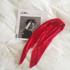 Red pleated imitation silk small scarf, elegant spring accessory with fine pleats for women.