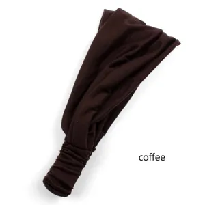 Close-up of brown solid color elastic pleated headband, soft fabric for daily wear.