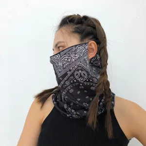 Detailed shot of a black paisley print sun protection face mask, neck cover for cycling.