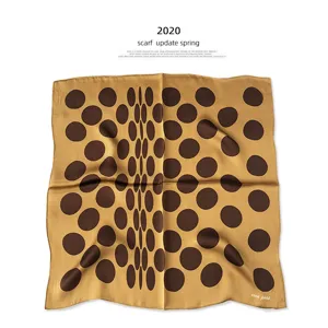 Milk tea color mulberry silk small square scarf featuring elegant polka dot pattern.