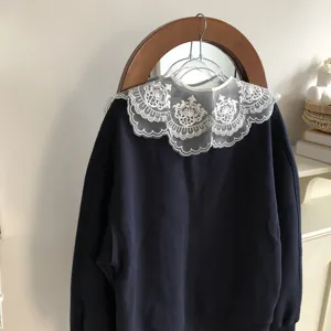 Versatile dark blue sweatshirt paired with an elegant white lace embroidered detachable collar.