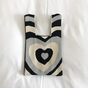 Knit tote bag for women, black and grey heart pattern, casual knitted shoulder bag, chic woven handbag.