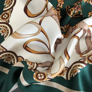 Detailed close-up view of the luxury gemstone green silk scarf with elegant chain print.