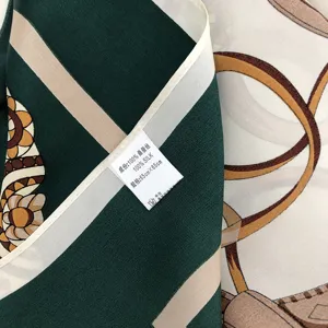 Luxurious 100% mulberry silk square scarf with classic chain print design, size 65x65cm.
