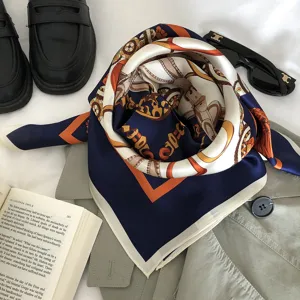 Luxury silk scarf with classic equestrian chain print, elegant square scarf accessory.