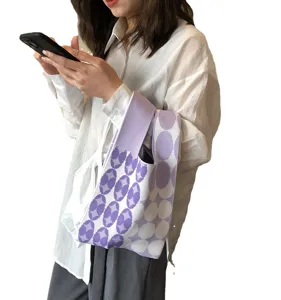 Stylish purple knit tote bag for women, trendy geometric woven shoulder handbag for daily use.