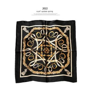 Classic black silk scarf with elegant gold equestrian belt and baroque print design for women.