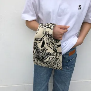 Schwarze und weiße Strick-Tragetasche für Damen, stylische gemusterte Freizeittasche.