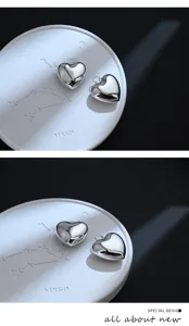 Vista dettagliata del grande ciondolo a cuore DIY, ottone argentato lucido, finitura liscia.