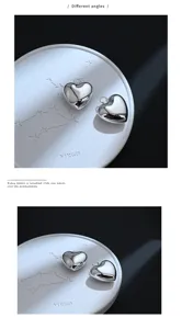 Primo piano del ciondolo a cuore liscio, con lavorazione raffinata e design senza giunture.