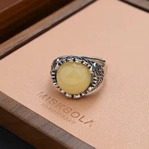 Vintage silver ring with yellow stone, retro ethnic design for women fashion chic.