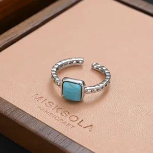 Vintage silver open ring with square synthetic turquoise stone, stylish hip-hop jewelry piece.