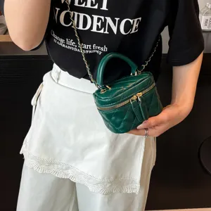 Green quilted chain box bag, stylish top-handle crossbody bag for women daily use.