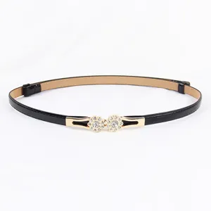 Women black thin waist belt with sparkling rhinestone flower buckle for dresses main view.