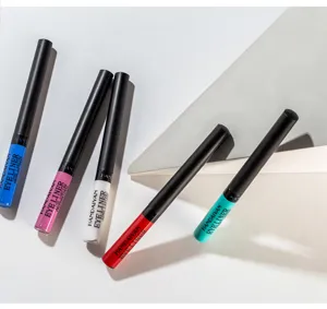 Detailed close-up of colorful liquid eyeliner pens arranged neatly on geometric studio props.