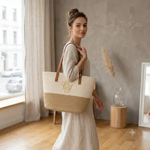 Detailed view of handmade woven cotton straw tote bag with shoulder straps and chic design.