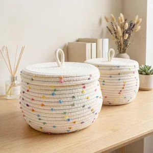 Nordic cotton rope woven storage basket with lid and colorful pom-poms for desktop and home organization.