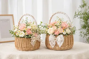Detailed view of pastoral woven flower baskets with lace handles and fresh floral arrangement.