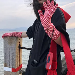 Red and white checkered knit gloves, mid-length touchscreen woolen fashion accessory for winter warmth.