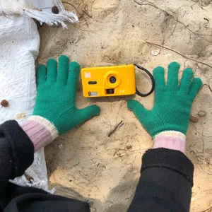 Detailed shot of cozy color-block knitted gloves with warm ribbed cuffs for winter cold.