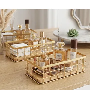 Nordic gold wire storage basket detail view showing iron frame and wooden base on table.