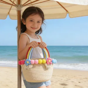 Charming woven beach bag detail with colorful pom-poms, rainbow handles and summer use.