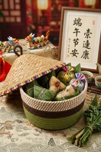 Detail view of the cotton rope woven storage basket with straw lid and festive gift setup.