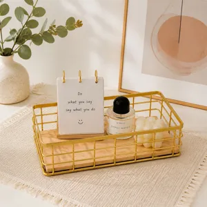 Nordic gold wire storage basket detail view with wooden base, stylish desktop organizer scene.
