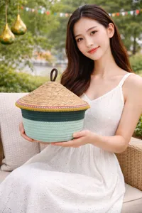 Handcrafted cotton rope storage basket with straw lid, detailed lifestyle view showing texture.