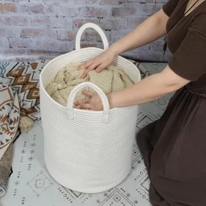 White woven cotton rope laundry basket detail showing soft texture and sturdy double handles.