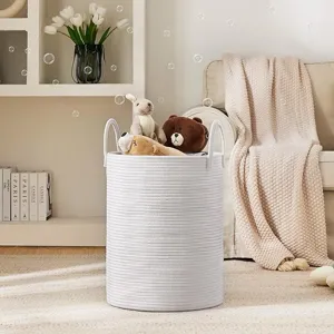 Nordic white cotton rope laundry basket with handles, ideal for organizing toys and clothes.