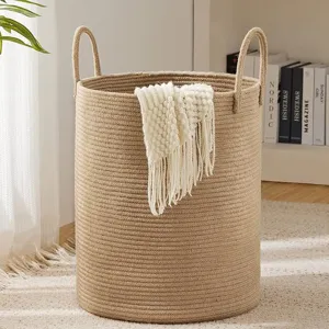Woven cotton rope laundry basket storage hamper with sturdy handles for home organization.