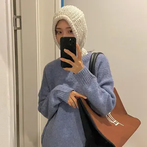 Cozy knitted balaclava detail showcasing soft texture and warm winter design in daily wear.