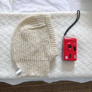 Cozy cream knit balaclava winter warm earflap hood hat for women stylish daily wear.