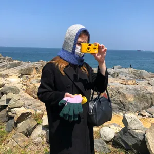 Detail view of a Korean style wool balaclava with color-blocking design, cozy winter warm hat.