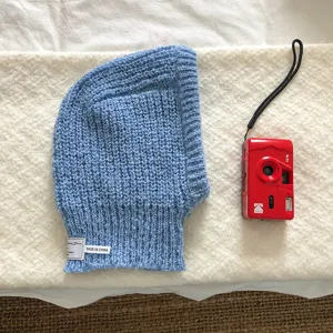Blue knitted balaclava hat detail view, winter warm earflap beanie cap for women.