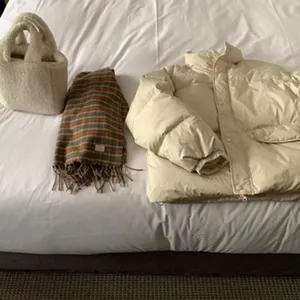 Winter warm plaid scarf and winter outfit clothing combination detail flat lay display