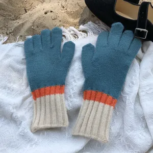 Detailed view of color-blocked knitted gloves featuring blue, orange, and white cozy design.