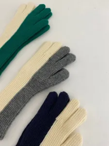 Detailed view of women's colorblock knit gloves, stylish winter warm woolen gloves.