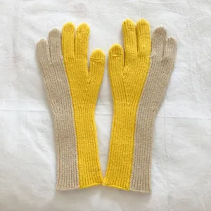 Close up details of women colorblocked knit gloves, cozy wool material for winter warmth.