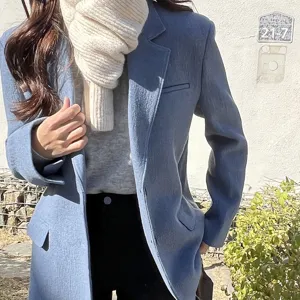 Knit warm mini scarf for winter, solid color wool cross scarf detail view, cozy apparel accessory.