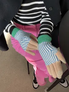 Colorblock knit gloves with stripe and chevron patterns for winter warmth and cozy daily wear.