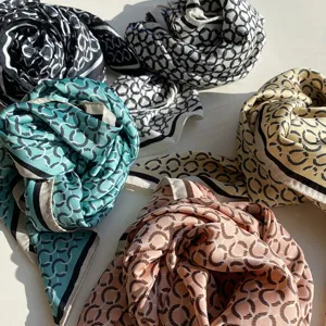 Detailed view of 70cm square silk scarf featuring an elegant chain link pattern in multi colors.