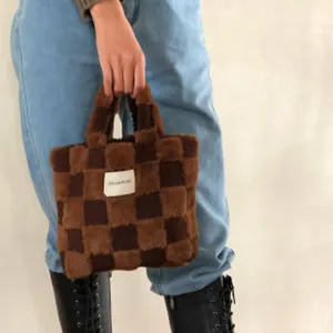 Brown checkered plush handbag for women, cute fluffy tote bag with short handle and soft fabric.