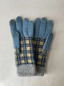 Winter warm knit gloves with trendy blue and yellow plaid pattern and cozy ribbed cuffs.
