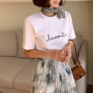 Stylish black and white geometric silk square scarf, perfect for neck or bag decoration.
