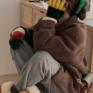 Cozy knit five-finger gloves in colorful striped design, winter thermal accessory detail shot.