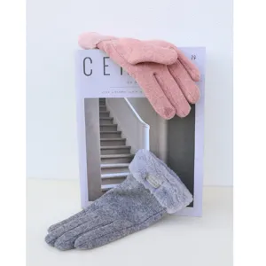 Winter women's touch screen gloves detail shot, soft plush warm suede thermal design.